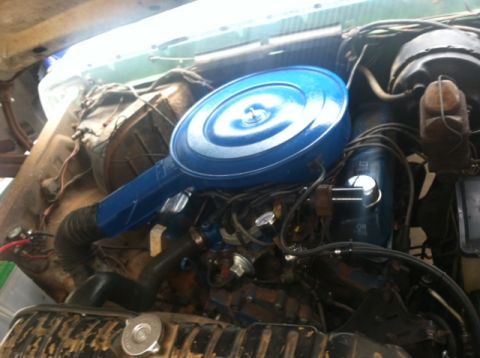 1977 Ford F-350 - Engine bay detail a prominent blue air cleaner assembly and various engine parts.