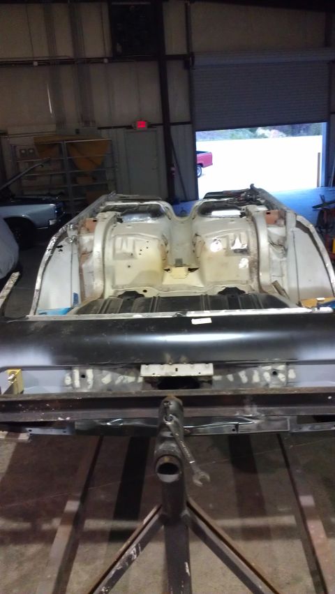 1972 Pontiac Trans Am - This vehicle's rear end is exposed and undergoing restoration work in a garage.
