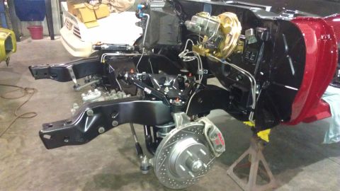 1972 Pontiac Trans Am - Front suspension and brake assembly of a car undergoing restoration.