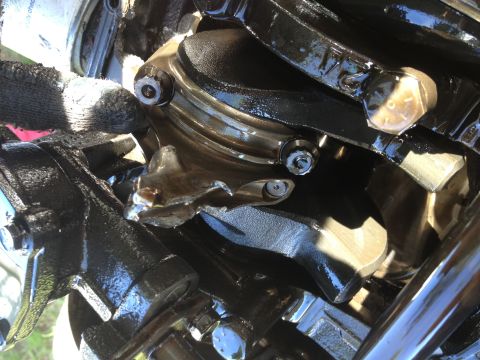 1995 Ford Bronco - This is a close-up view of internal engine components, likely the crankshaft and connecting rods, covered in oil.