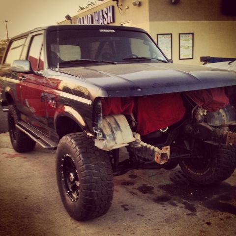 1995 Ford Bronco - This 1995 Ford Bronco is shown with its front end disassembled, revealing red fabric stuffed into the engine compartment.