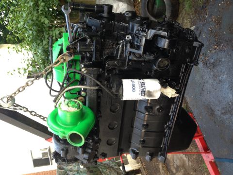1995 Ford Bronco - Engine with turbocharger and oil filter, likely part of a vehicle modification project.