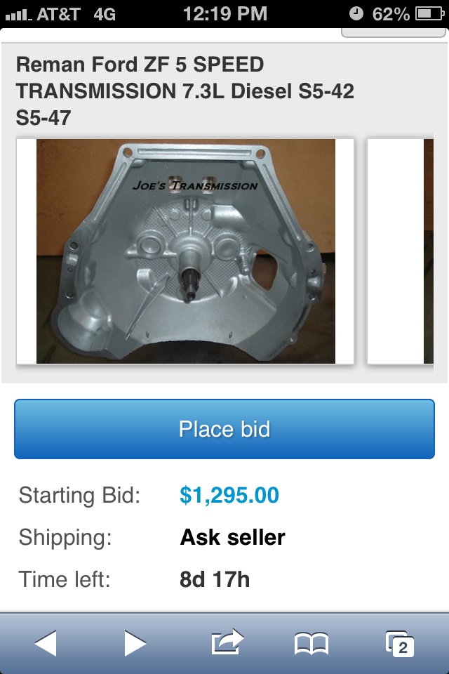 Silver transmission bell housing with "JOE'S TRANSMISSION" text, viewed from the front