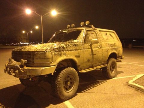 1995 Ford Bronco - This off-road vehicle is covered in mud after a recent excursion.
