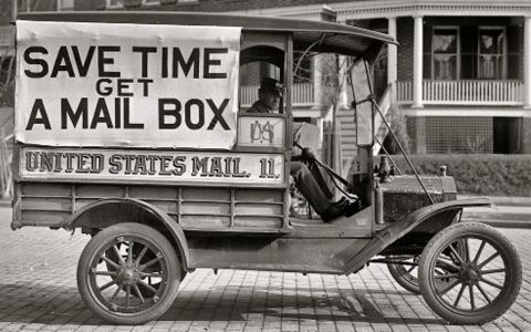 1912 Ford Model T - A vintage mail truck is shown with a banner promoting mailboxes and "United States Mail" signage.