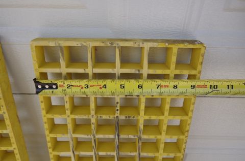 1983 Ferrari Enzo - A yellow plastic grille section is measured with a tape measure, showing its dimensions.