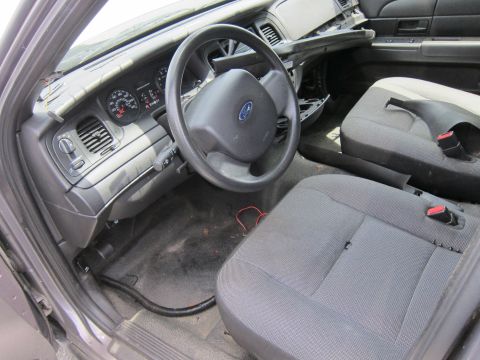 1991 Ford LTD Crown Victoria - Interior view of a 1991 Ford Crown Victoria LTD, showing the dashboard, steering wheel, and front seats.