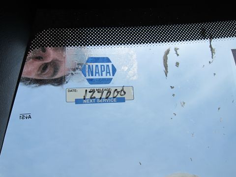 1991 Ford LTD Crown Victoria - A NAPA service sticker on a windshield indicates the next service date was December 7, 2006.