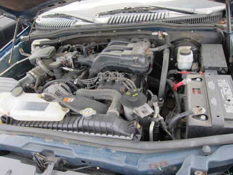 1991 Ford LTD Crown Victoria - The engine bay of a vehicle is shown with various components and wiring.
