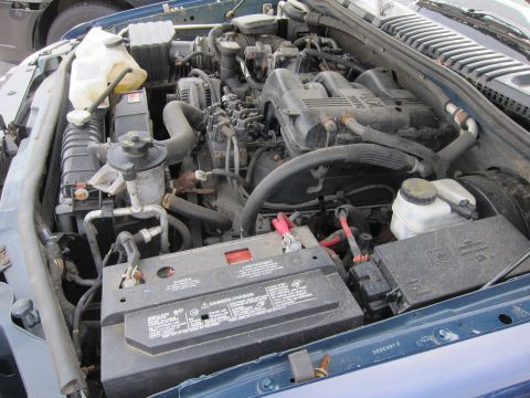 1991 Ford LTD Crown Victoria - Close-up view of a vehicle's engine bay, showing various components and wiring.