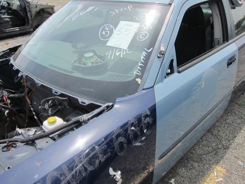 1991 Ford LTD Crown Victoria - A blue car door and fender are visible, with handwritten markings and a tag on the windshield.