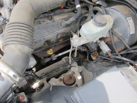 1991 Ford LTD Crown Victoria - Engine bay components including air intake, valve cover, and brake system parts are visible.