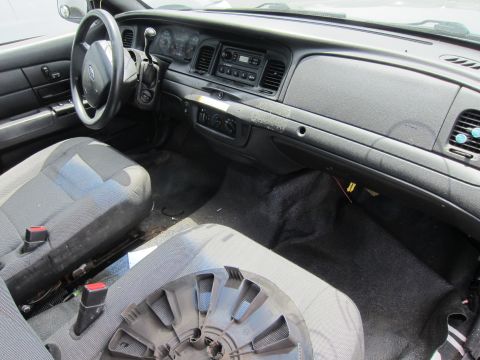 1991 Ford LTD Crown Victoria - The interior of a Ford Crown Victoria is shown, the dashboard, steering wheel, and seats.