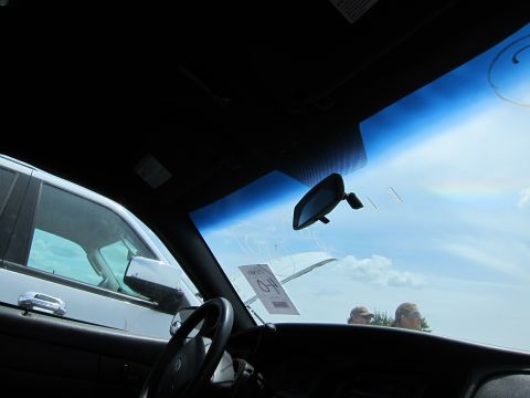 1991 Ford LTD Crown Victoria - View from inside a car shows another vehicle and an auction tag on the windshield.