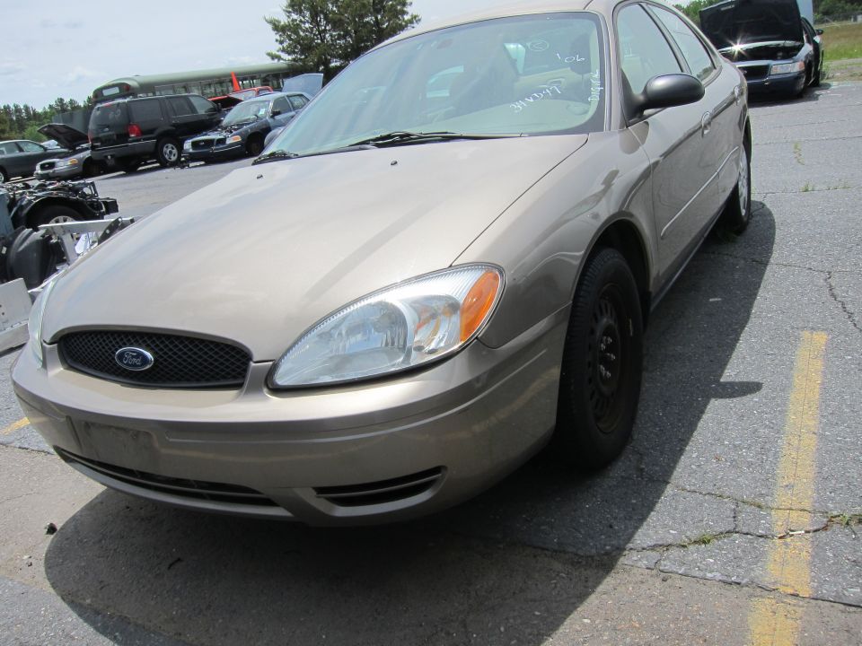 Tan Ford sedan front view