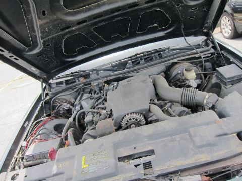 1991 Ford LTD Crown Victoria - Engine bay of a 1991 Ford Crown Victoria LTD, viewed from above with the hood raised.