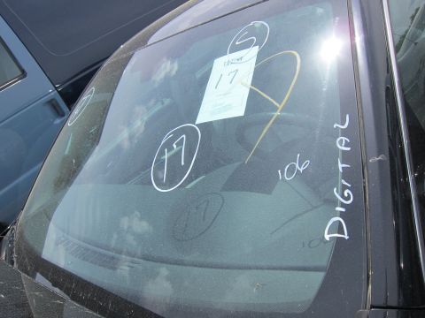 1991 Ford LTD Crown Victoria - The windshield of a vehicle is marked with "DIGITAL" and circled numbers, with another vehicle visible to the left.
