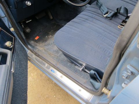 2001 Ford Crown Victoria - Passenger side interior of a car, showing the seat and door jamb area.