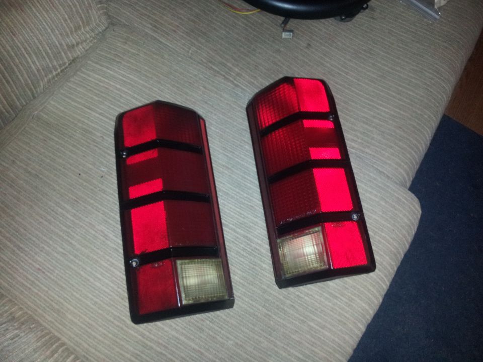 Pair of red taillights with black trim