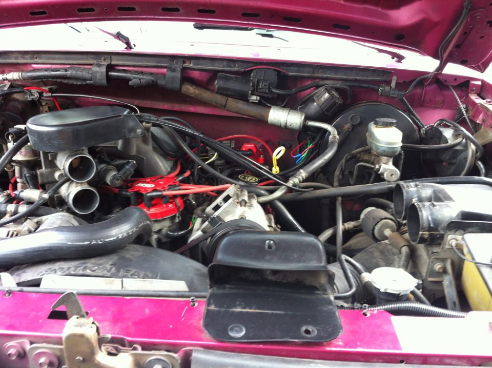 This is not a complete write-up. I sorta took these pictures as reference, but figure I would write out how I did it.

First I disconnected the negative battery cable. I did this because I knew I would be unplugging a lot of the sensors of the engine as well as working around the ignition system. After that I removed the air intake hoses to give me more room to work and to get them out of the way.