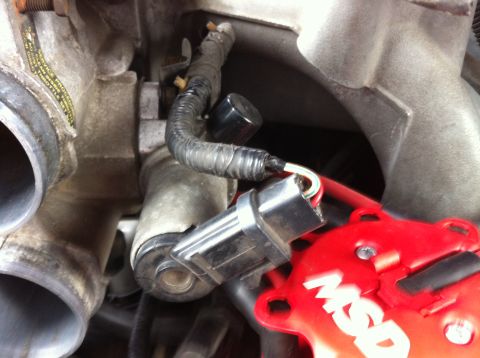 1992 Ford F-150 - Unplug all of the sensors mounted to the throttle body. Shown is the IAC valve. There is also the TPS to unplug.