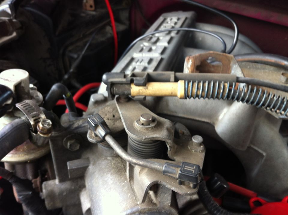 Remove the cover for the throttle cable assuming it is still there and disconnect the throttle/cruise cable. It pops off of a little ball. I used a small flat head screw driver.