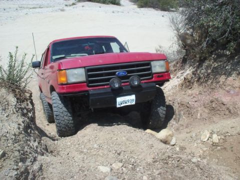 1988 Ford Bronco - This 1988 Ford Bronco navigates a challenging off-road trail.
