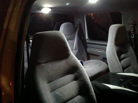 1997 Ford F-350 - The interior of a 1997 Ford F-350, cloth seats and interior lighting.