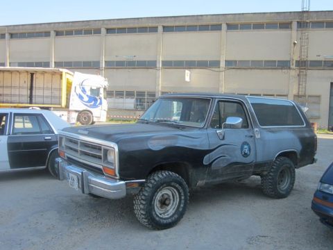 1991 Ford Crown Victoria - This Dodge Ramcharger, likely from the early 1980s, features custom flame decals and appears ready for off-road adventures.