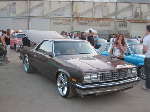 1991 Ford Crown Victoria - Customized 1980s Chevrolet El Camino on display at a car meet.