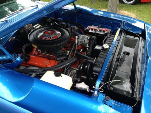 1988 Ford Bronco - Close-up of the engine bay in a blue 1969 Dodge Charger R/T, highlighting the Super Commando air cleaner.