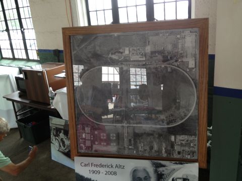 1988 Ford Bronco - An aerial photograph of a facility, possibly a race track, is displayed in a wooden frame.