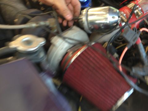 1995 Ford Probe - Close-up view of an engine bay, showing various aftermarket components and wiring.