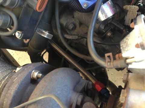 1995 Ford Probe - Close-up view of an engine bay a turbocharger and various hoses, with 'SUPERMOTORS.NET' visible at the bottom.