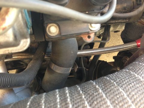 1995 Ford Probe - Close-up view of engine bay components including hoses and wiring.
