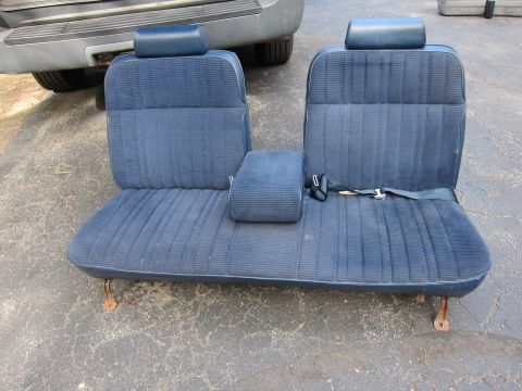 2001 Ford Crown Victoria - A set of blue fabric car seats with headrests and a seatbelt is shown from the front.