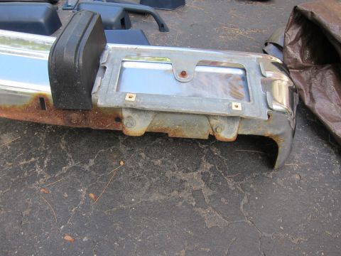 2001 Ford Crown Victoria - Front bumper section showing chrome, rubber strip, and license plate holder.