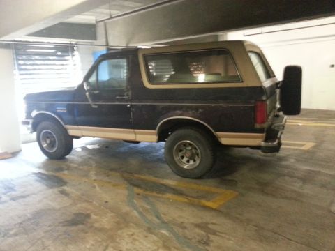 1989 Ford Bronco - This 1987 Ford Bronco is seen from a three-quarter front angle in a parking garage.