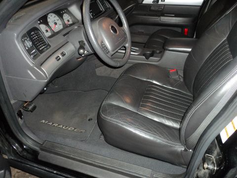 2004 Mercury Grand Marquis - Interior view of a 2004 Mercury Grand Marquis, the driver's seat and dashboard.