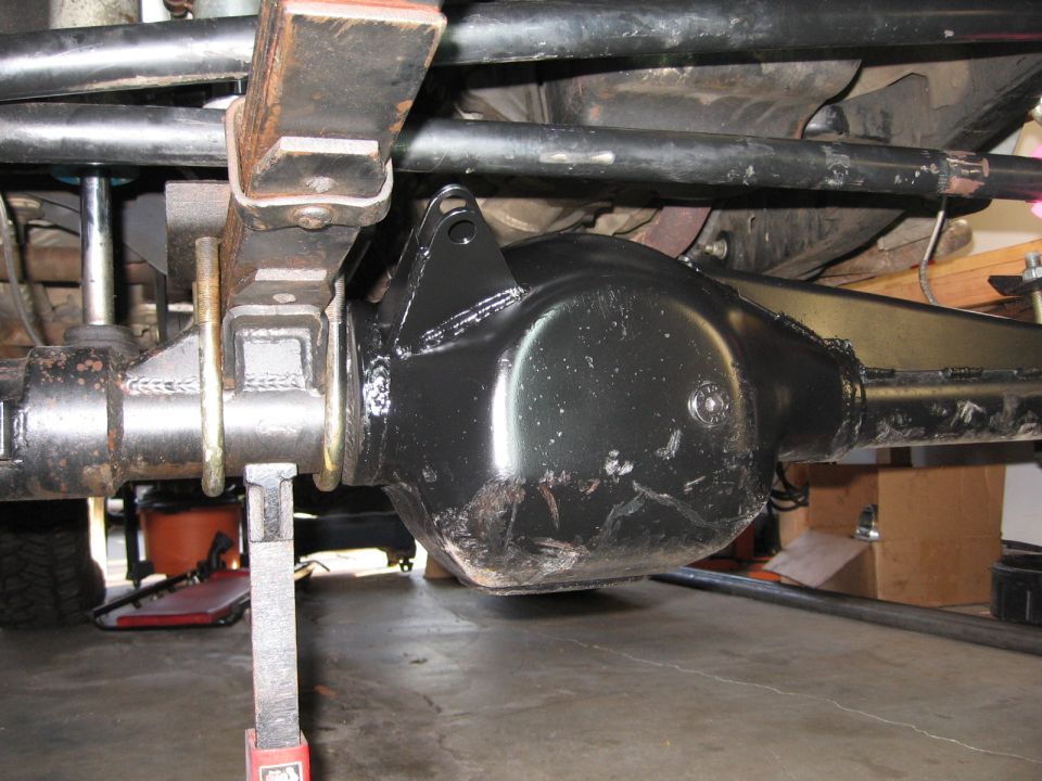 Rear differential assembly on a vehicle supported by a jack stand