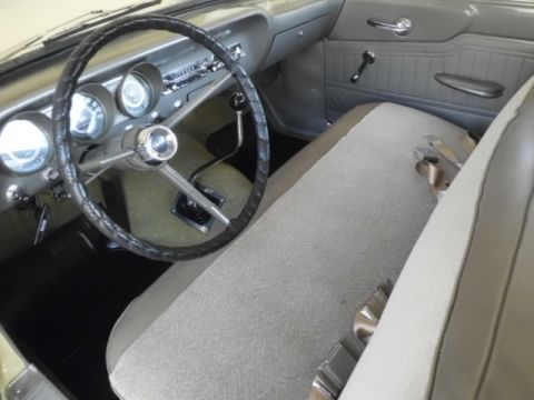 1963 Ford Fairlane - Interior view of a 1963 Ford Fairlane, its bench seat and dashboard instrumentation.