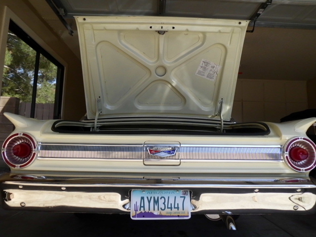 Rear of a cream-colored 1962 Ford Galaxie with trunk open. Arizona license plate AYM3447