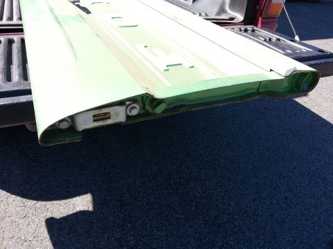 1967 Ford F-100 - Close-up view of a vehicle tailgate, showing its internal structure and mounting hardware.
