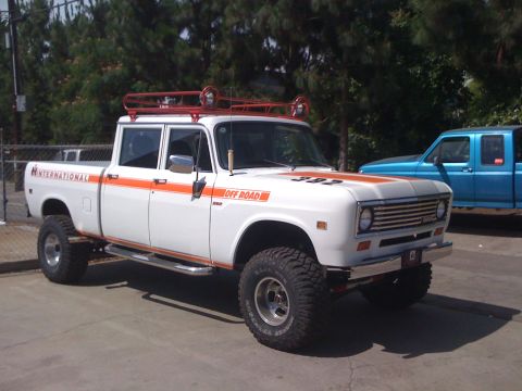 1968 Ford Mustang - This lifted International pickup truck features orange racing stripes and an off-road designation on its hood.