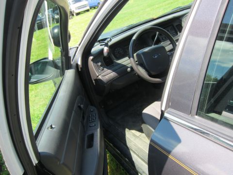 2001 Ford Crown Victoria - Interior view of a 2001 Ford Crown Victoria, highlighting the dashboard and driver's side.