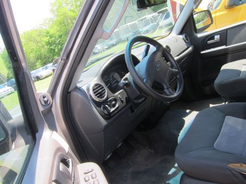 2001 Ford Crown Victoria - Interior view of a car, focusing on the dashboard and driver's seat area.