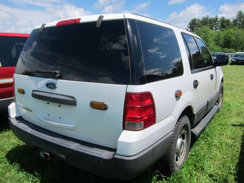 2001 Ford Crown Victoria - Rear view of a white Ford Expedition SUV parked outdoors on a sunny day.