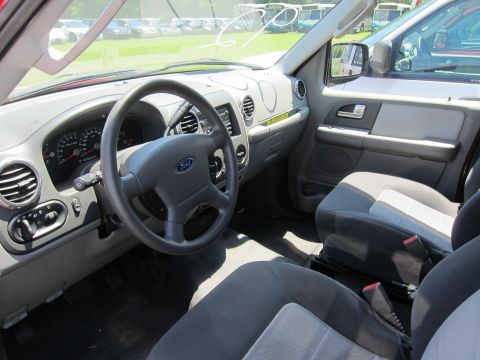 2001 Ford Crown Victoria - The interior of a Ford SUV, likely from the mid-2000s, is visible from the passenger side.