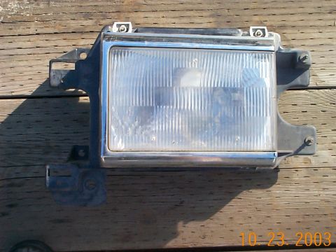 1983 Ford Bronco - Driver side headlight assembly, good ~ $5