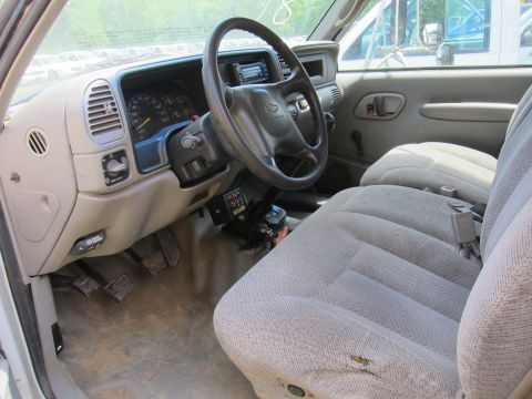 2001 Ford Crown Victoria - Interior view of a 1995 Chevrolet pickup truck, including dashboard, steering wheel, and seats.